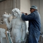 At the Marble Studio - An artisan sculpting by hand a replica of the Bacchus by Michelangelo